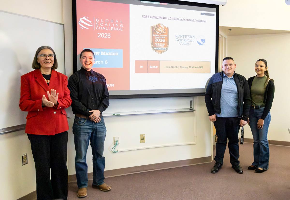 From left: Dean Alina Chircu, UNM Anderson School of Business with Team North members Julian Baros, Jeff Klingbeil and Gabriella Gonzales.